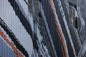 Geometrische street art in Rotterdam transformeert gevelopppervlak