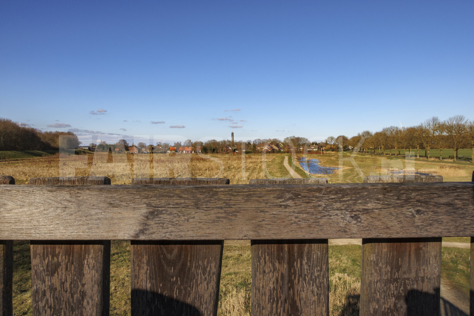 Scenic landscape view from a wooden fence in a rural area with a