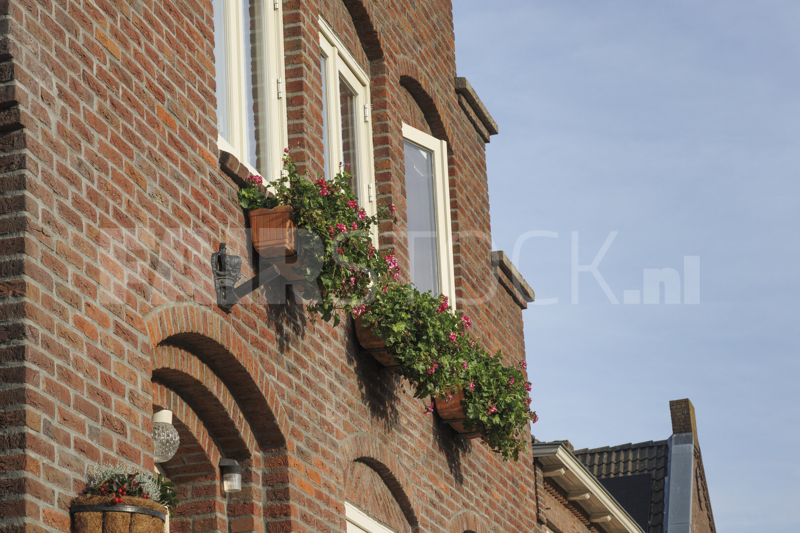 Charming brick building in Noord-Brabant with flowering window b